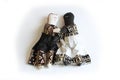 Black doll and white doll holding hands concept inclusion, racial harmony, togetherness Royalty Free Stock Photo