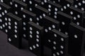 Black Dominoes on dark background, Closeup scattered dominoes on a gray, table. Board game, Game night Dominos table game Royalty Free Stock Photo