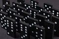 Black Dominoes on dark background, Closeup scattered dominoes on a gray, table. Board game, Game night Dominos table game Royalty Free Stock Photo