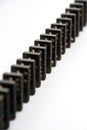 Black Dominoes Standing in Line Royalty Free Stock Photo