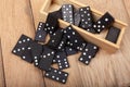 Black Dominoes on wooden background. Board game