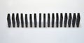 Black dominos in chain on white background Royalty Free Stock Photo