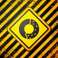 Black Donut with sweet glaze icon isolated on yellow background. Warning sign. Vector Illustration