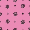 Black doodle paw print pink background Royalty Free Stock Photo