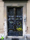 Black door covered in graffiti writing