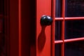 Black door handle on the English phone booth Royalty Free Stock Photo