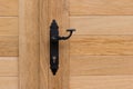 Black door handle, wooden doors Royalty Free Stock Photo