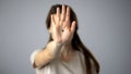 Black dot on womans hand, secret sign of domestic violence victim, support Royalty Free Stock Photo