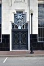 Black art deco double doors main entrance downtown building Royalty Free Stock Photo