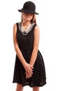 Black dress, black hat, white pearls. Royalty Free Stock Photo