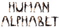 Black dressed people forming word HUMAN ALPHABET