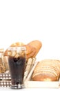 Black drink (cola) and donuts and sugar over lettuce over white Royalty Free Stock Photo