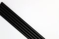 Black drinking paper straws on white background Royalty Free Stock Photo