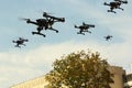 Black drone army flying in the city Royalty Free Stock Photo