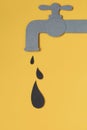 Black drop dripping from tap. Oil concept.