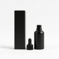 Black dropper bottle and box isolated on white background Royalty Free Stock Photo