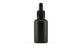 A black dropper bottle with a black cap and a black dropper for essential oils Royalty Free Stock Photo