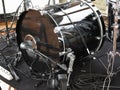 Black drum kit, cables and microphones closeup