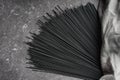 Black dry raw noodles on dark background Royalty Free Stock Photo
