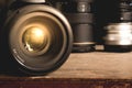 Black DSLR camera with 50mm 1.8G prime lens on an old brown wooden vintage box surface Royalty Free Stock Photo