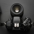A black DSLR camera is positioned Royalty Free Stock Photo
