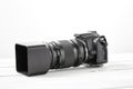 BLACK DSLR Camera with tele lens Royalty Free Stock Photo