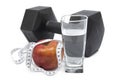 Black dumbbells, cup, tape measure and apple on a white background. Royalty Free Stock Photo