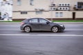 Black dusty Chevrolet Cruze car on the road. Daewoo Lacetti Premiere in motion