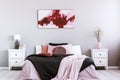 Black duvet on king size bed in classy bedroom interior Royalty Free Stock Photo