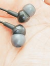 Black Ear phones on the hand Royalty Free Stock Photo