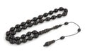 Black ebony rosary prayer beads isolated on white