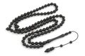 Black ebony wood rosary prayer beads isolated on white Royalty Free Stock Photo