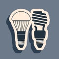 Black Economical LED illuminated lightbulb and fluorescent light bulb icon isolated on grey background. Save energy lamp Royalty Free Stock Photo