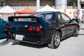 black eighth-generation Nissan Skyline GT R32 at a Japanese car meet Royalty Free Stock Photo