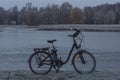 Black electric bicycle near pond in Stromovka garden in Budweis city