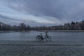 Black electric bicycle near pond in Stromovka garden in Budweis city