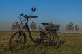 Black electric bike on ski slope in Budweis city with windy trees Royalty Free Stock Photo