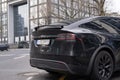 black electric car tesla, Model X on street, popular Elektro-SUV from company Elon Musk, alternative energy development, clean Royalty Free Stock Photo