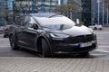 black electric car tesla, Model X on street, popular Elektro-SUV from company Elon Musk, alternative energy development, clean Royalty Free Stock Photo