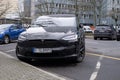 black electric car tesla, Model X on street, popular Elektro-SUV from company Elon Musk, alternative energy development, clean Royalty Free Stock Photo