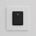 Black electric light switch on a white wall. 3d illustration. Royalty Free Stock Photo