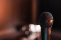 Black electric microphone on empty stage Royalty Free Stock Photo