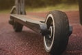 black electric scooter standing on the rubber pad in the park, rear view Royalty Free Stock Photo