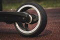 black electric scooter standing on the rubber pad in the park, rear view Royalty Free Stock Photo