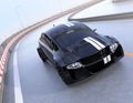 Black electric sports car driving on the highway