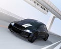 Black electric sports car driving on the highway