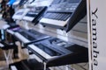 Black electronic piano Yamaha synthesizers in musical store