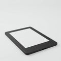 A black electronic tablet with a rectangular shape and sleek design is positioned at an Royalty Free Stock Photo