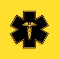 Black Emergency star - medical symbol Caduceus snake with stick icon isolated on yellow background. Star of Life. Long Royalty Free Stock Photo