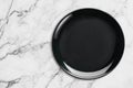 Black Empty Ceramic Plate on marble table